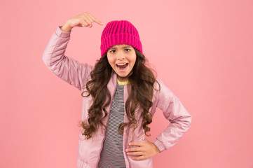 Nice hat. Little kid wear puffer jacket and knitted hat. Winter shopping. Happy childhood. Trendy accessory. Tender style. Dress warm in winter. Clothing item. Ready for cold winter. Accessories shop