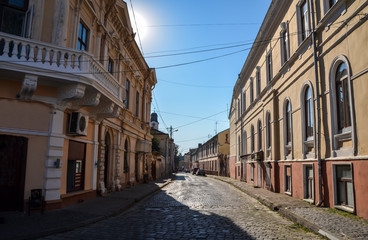 Fototapeta na wymiar Old street, houses and architecture in Chernivtsi, Ukraine