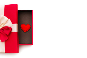 Gift or gift box, red heart inside the box on a white background top view. Greeting card for Valentine's Day
