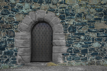 old wooden door in stone wall