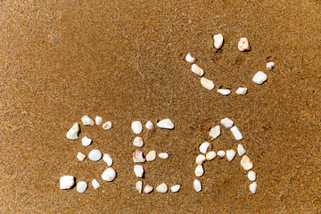 the inscription with stones in the sand the word 