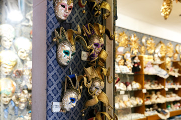 Handmade masks on a store window in Venice. Venetian masks