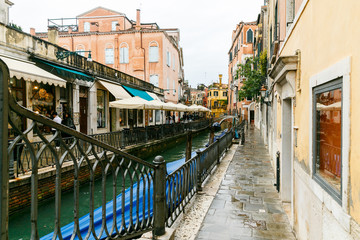 Fototapeta na wymiar Traditional canal street with gondola in Venice, Italy