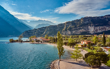 Panorama of Torbole a small town on Lake Garda, Italy. Europa.beautiful Lake Garda surrounded by mountains in the summer time