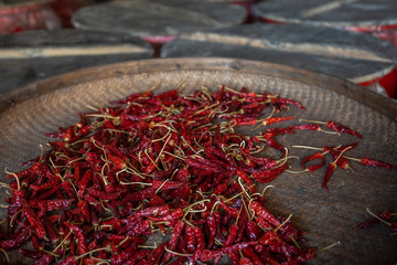 Chili drying in a wicker bowl