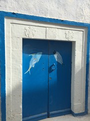 The Medina of Tunis is the Medina quarter of Tunis. Traditional old painted door in a historical district or medina, Tunisia. Colorful textured image of muslim architecture.