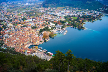 Fototapeta na wymiar Panoramic view of the beautiful Lake Garda .Riva del Garda town and Garda lake in the autumn time , Trentino Alto Adige region,Italy