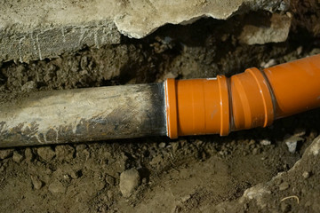 Replacement of cast iron sewer pipes with plastic.