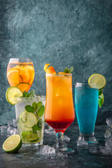 Set of alcoholic and non-alcoholic drinks. On a turquoise background. Cocktail menu. Sea mood concept.