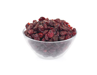 Dried cranberries in glass bowl isolated on white background.  
