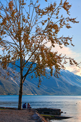 Beautiful and colorful autumn in Riva del Garda, Garda lake surrounded by mountains, Trentino Alto Adige region, Lago di garda, italy