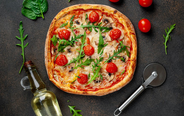 tasty italian pizza with mozzarella cheese, mushrooms, tomato, bell pepper, onion on a stone background