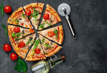 tasty italian pizza with mozzarella cheese, mushrooms, tomato, bell pepper, onion on a stone background with copy space for your text