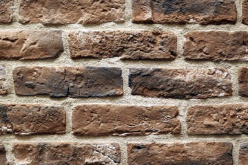 Brown brick wall, abstract background texture.
