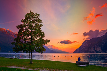 Beautiful and colorful autumn in Riva del Garda, Garda lake surrounded by mountains, Trentino Alto...
