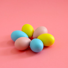 Easter eggs on the pink background. Holiday spring background.