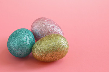 Easter eggs on the pink background. Holiday spring background.