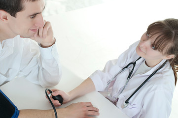 doctor examining her patient