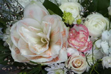 Close-up bright floral arrangement in pastel colors in a hat box, greeting concept