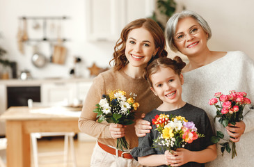 mother's day! three generations of  family mother, grandmother and daughter congratulate on the...