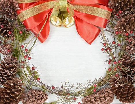  wreath with red bow, cones, berries and bells - Powered by Adobe