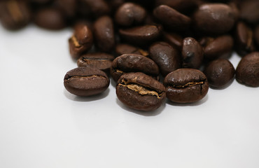 coffee seeds spilling - white background of beans