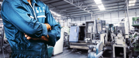 The image Engineer is wearing a uniform safety for industry background. men is standing with arms...