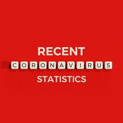 Coronavirus recent statistics blog cover image concept word written on a blocks top view