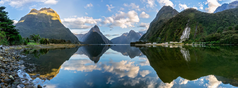 New Zealand, Scenic panorama of mountains reflecting on shiny surface of Milford Sound