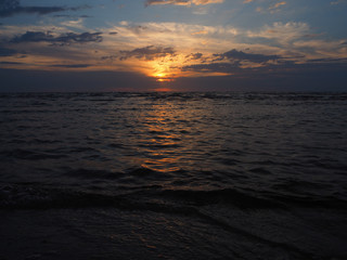 Sunrise in summer over dark sea