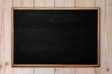 Fototapeta na wymiar Abstract blackboard or chalkboard with frame on wooden background.