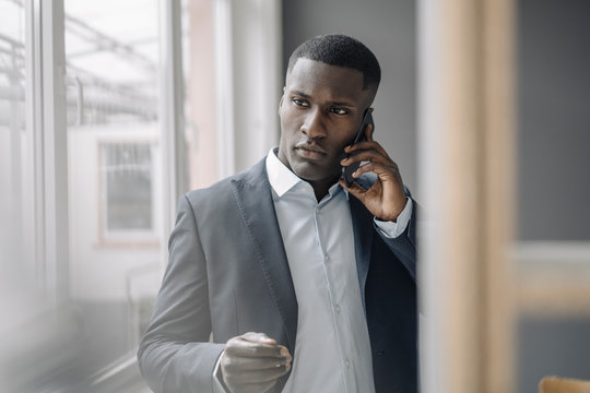 Portrait of young businessman on the  phone