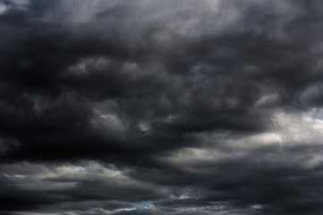 Naklejka na ściany i meble Close-up of some black clouds in the sky