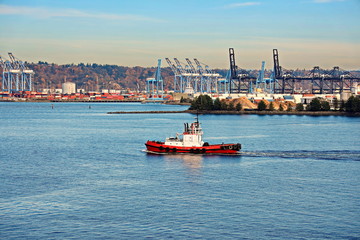 Pleasure boats and yachts, seagoing vessels and tugboats on the roads of the port of Tacoma, USA....