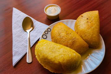 typical Colombian empanadas, served with chili pepper and tartara sauce, Bogotá Colombia, February...
