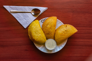 typical Colombian empanadas, served with chili pepper and tartara sauce, Bogotá Colombia, February...