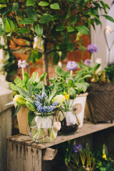 Flowers in Florist Shop with bouquets, potted plants and garden accessories