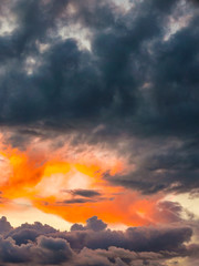 dramatic sky with sunset and dark rainy clouds
