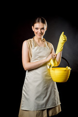 Housekeeper in uniform with clean spray, duster. housekeeper or happy wife cleaning with soap...