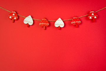 clothespins in the shape of a heart on a plain background with a place for text, festive concept, love