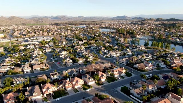 Aerial view of Menifee Lake and neighborhood, residential subdivision vila during sunset. Riverside County, California, United States