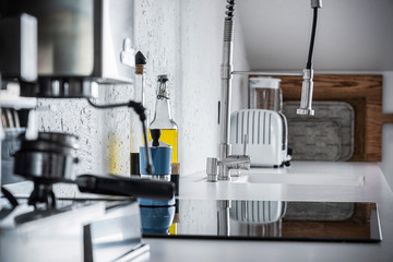 espresso machine and a bottle of olive oil