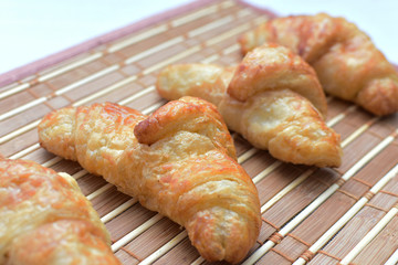 Small butter croissant, accompanied by blackberry jam