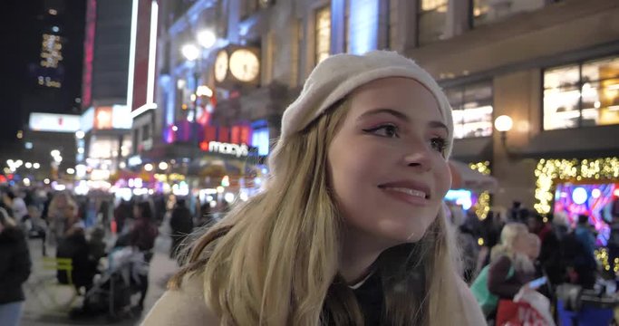 Happy content young millennial tourist woman on the streets of Manhattan NYC