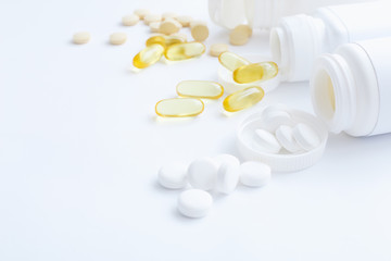 Assorted pharmaceutical medicine vitamins, pills, drugs on white background