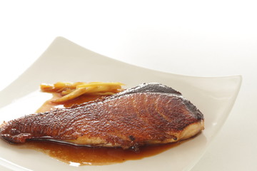 Homemade Japanese comfort food, pan fried yellow tail with ginger and soy sauce