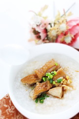 Soy sauce chicken on Chinese congee 