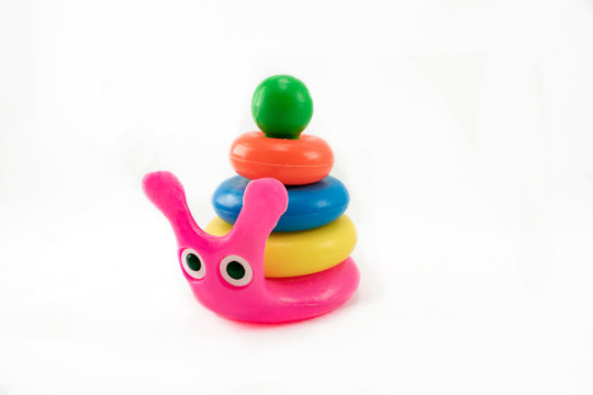 toy snail with a pyramid on a white background