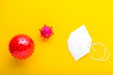 Chinese Coronavirus, wuhan virus, Coronavirus outbreak and coronaviruses influenza. Yellow background with place for text, a protective mask and coronavirus 2019 nCoV.