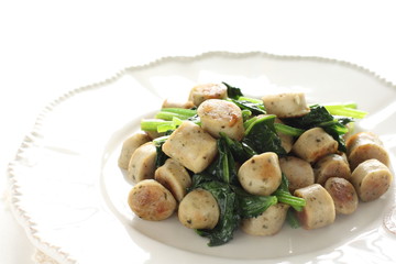 Asian food, herbal sausage and spinach sautéed